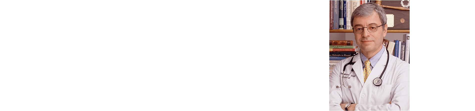 Dr. Nail Schatcher standing with his arms crossed.